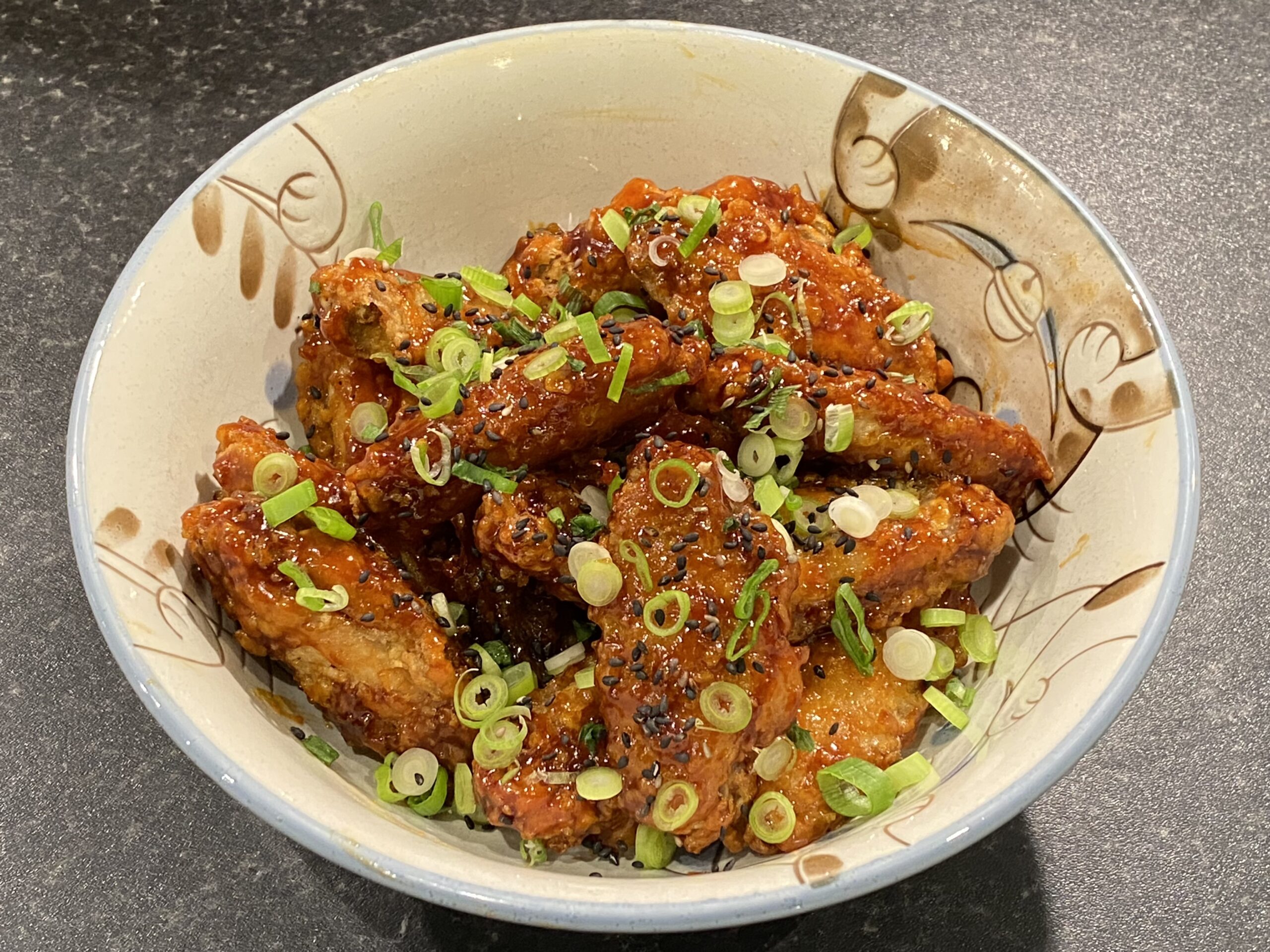 A bowl of Korean fried chicken wings